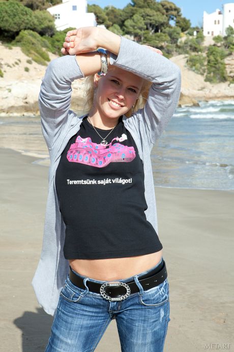 Hot teen Tracy A gets naked in a seductive way during a solo shoot