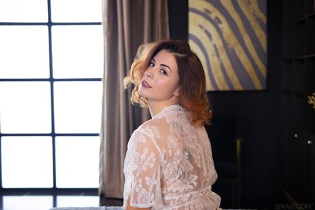 Redheaded teen Alice Kelly gets naked before a blowjob on a bed