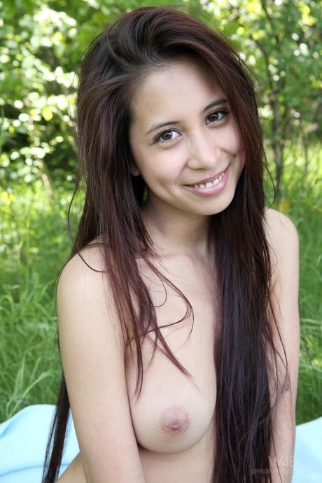 Hot teen Paula Shy gets totally naked on a blanket in a backyard