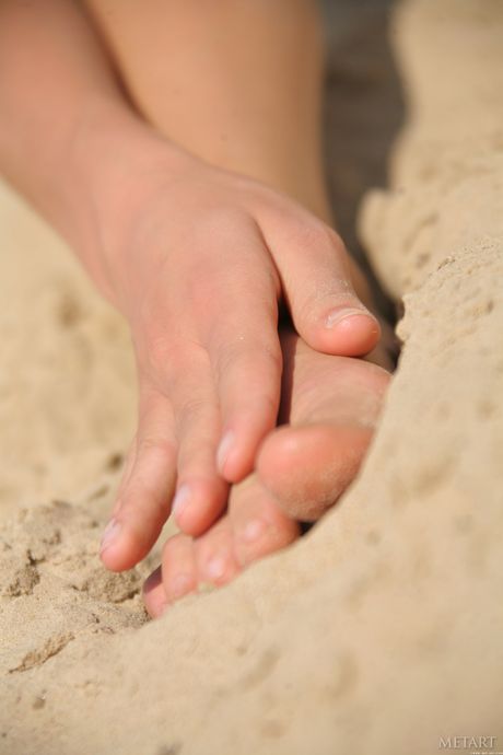 Delicate teen Selesta B reveals her big tits and poses nude in the forest