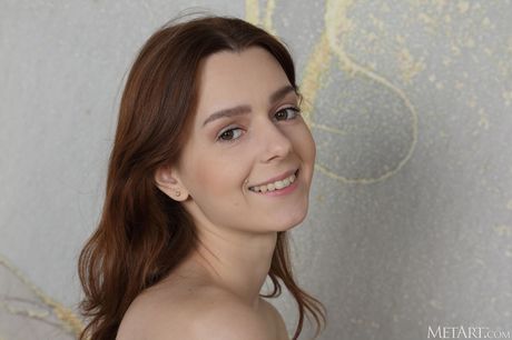 Russian erotic model Amber Plume gets naked without shyness during solo action