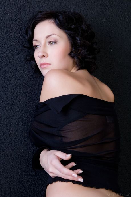 Hot teen Night A removes red stockings to get totally naked on a bed