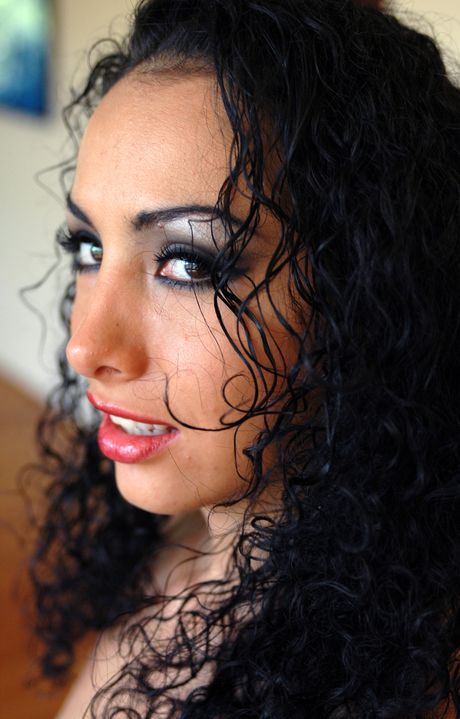 Sexy brunette Monique Madison strips and shows her big ass and tits