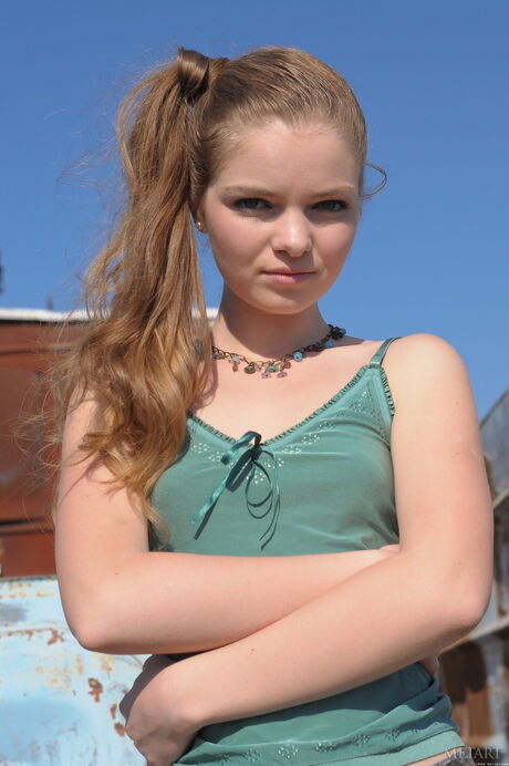 Russian beauty Bridgit A strips down on a patio in the sun