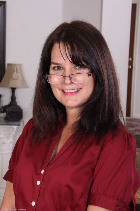 Mature secretary Sherry Lee shows her saggy tits and spreads her mature pussy