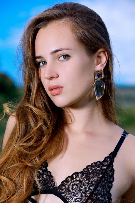 Russian cutie Hailey J removes her lingerie and stockings to pose nude