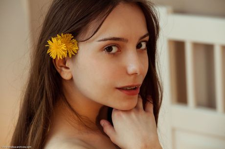 Precious teen Maxima takes off her underwear afore a window to get totallynaked