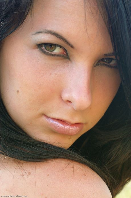 Katrin E poses naked in the forest as she shows her sexy body