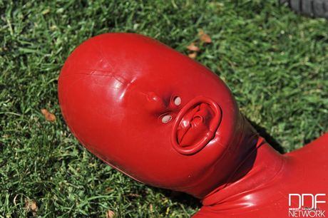 Busty German babe Sandy K. masturbates with a dildo in a garden