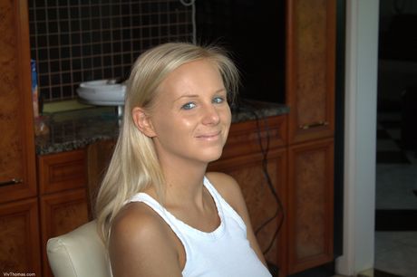 Teen lesbians Inna A & Barbie White use a sex toy during a nude shoot