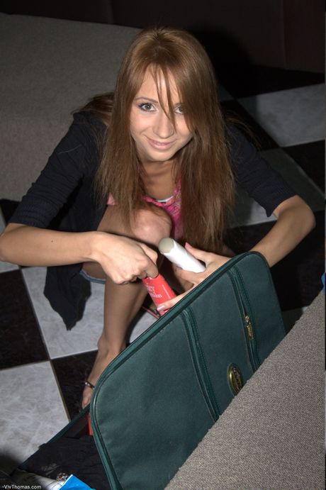 Teen lesbians Inna A & Barbie White use a sex toy during a nude shoot