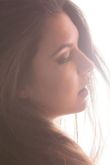 Delicate teen Keri bares her body before fingering her pussy on a rug