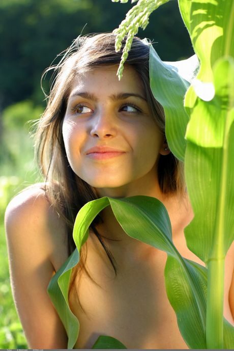 Pure teen girl with long hair Yulya poses naked without embarrassment