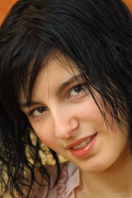 Adorable teen Michelle G removes a bikini and boots to get totally naked