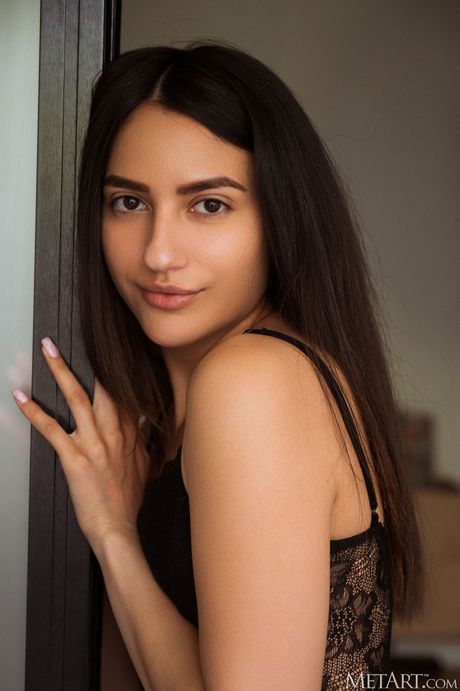 Russian model Cira Nerri removes her lingerie to pose nude in her bedroom