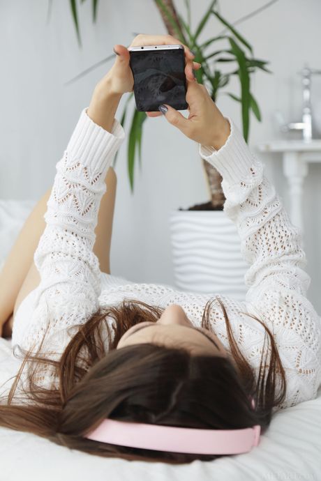 Alise Moreno gets naked and reveals her big tits and shaved pussy