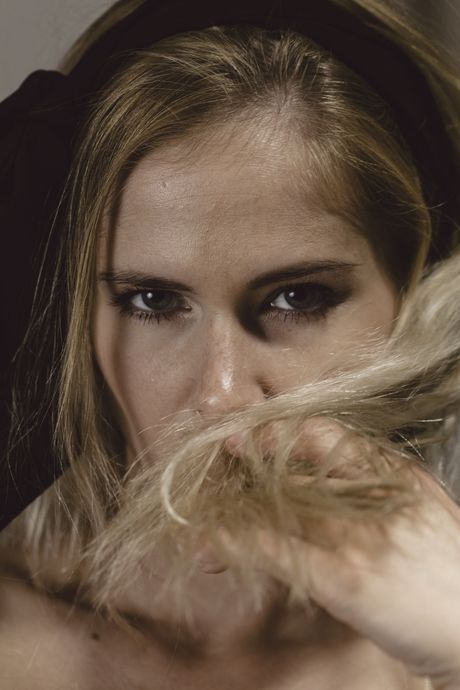 Blonde teen Tracy A removes a bikini to get naked on a bed