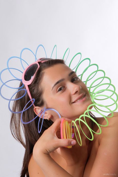 Desirable teen Penelope B reveals her naked form & exhibits her big tits & hot ass in a solo