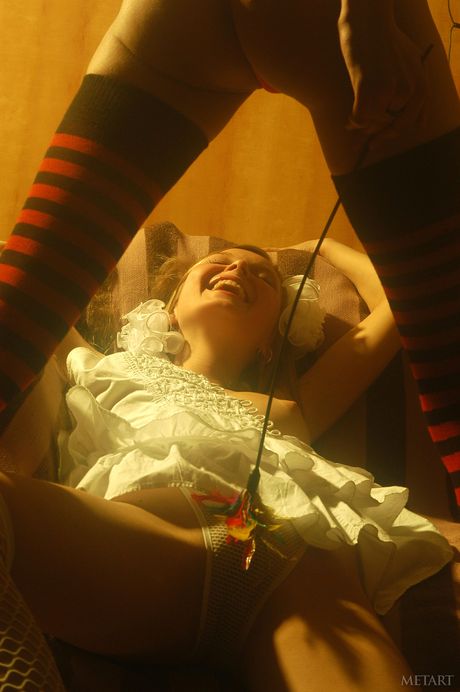 Ukrainian erotic model Cassandra A strips and poses in her stockings