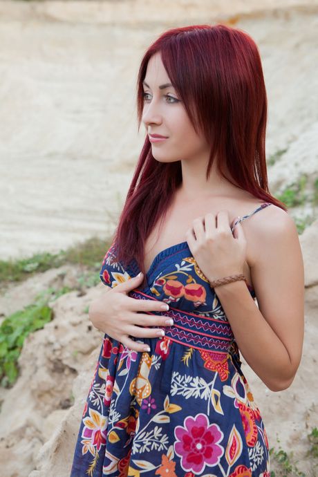 Skinny redhead Night A showing her big tits and bald pussy outdoors