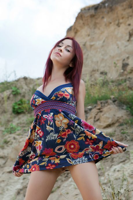 Skinny redhead Night A showing her big tits and bald pussy outdoors