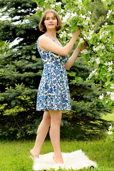 Brunette teen Aurelia Lu unveils her big tits and hot ass in the garden