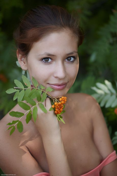 Teen solo girl Afrodita gets naked on a sandy beach in a bikini