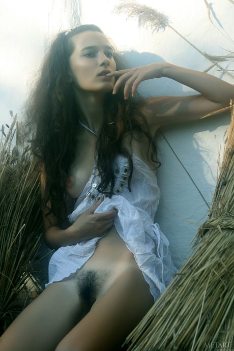 Delicate teen Sophie A strips naked in a barn & shows her hairy pussy