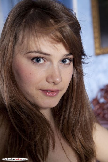 Angelic teen Mariara gets naked in a pair of stockings sensually