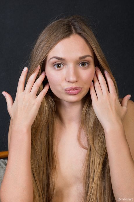 Young girl Berka hits upon great poses while completely naked on a bed