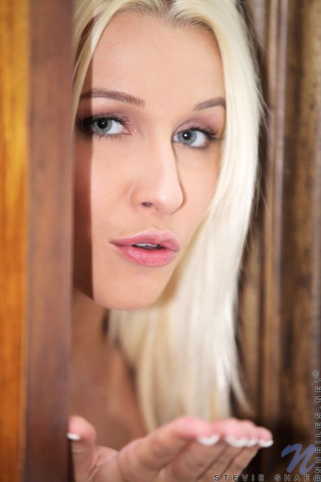 Ligh-haired teen Stevie Shae strips off her bikini before masturbating on a beach