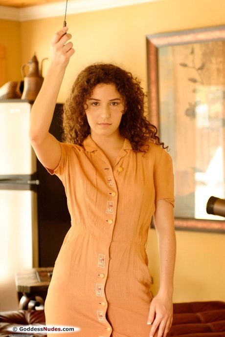 Petite teen Sativa shows off her hairy pussy in the nude during solo action