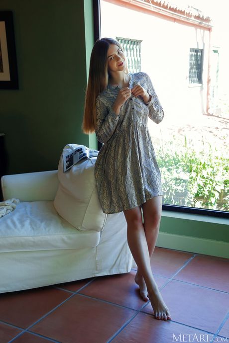 Cute teen Kay J goes nude on a daybed seductively