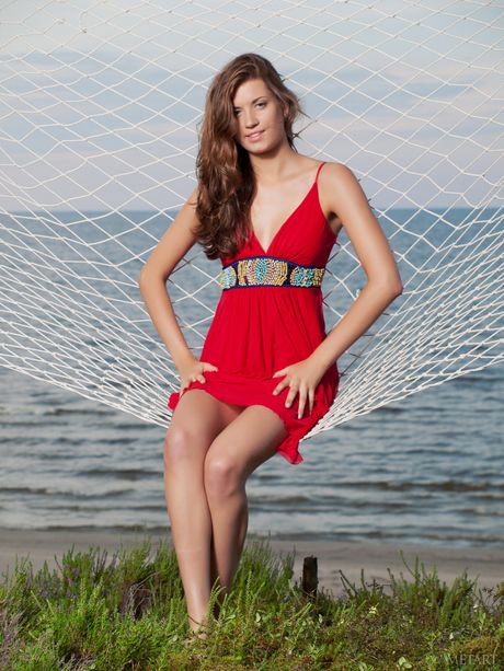 Brunette babe Amanda C unveiling big natural tits outdoors