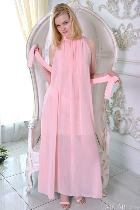 Lean teen Lucy Foster gets naked with certainty on a throne