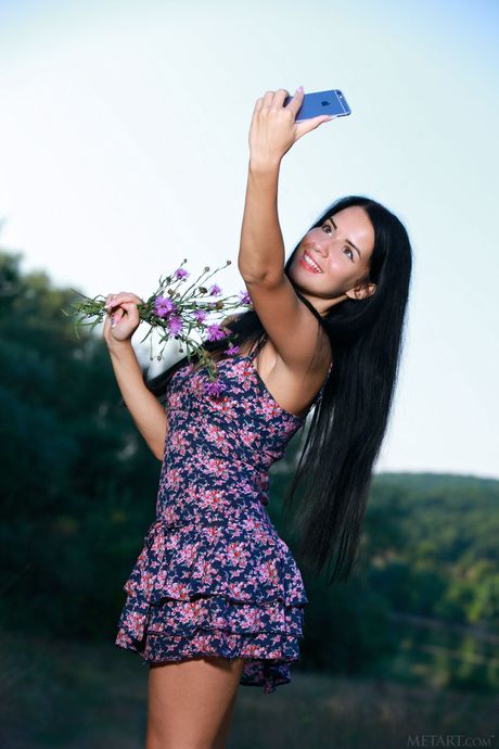 Lovely teen Lola Marron gets naked in a backyard before taking selfies