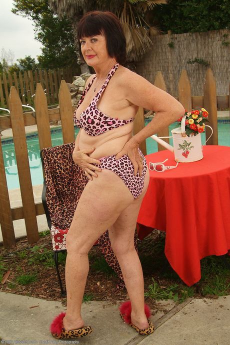 Chubby granny Mona shows her big ass and hairy holes poolside