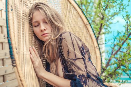 Italian teen Isla gets naked on a balcony in high heels during her first nude shoot