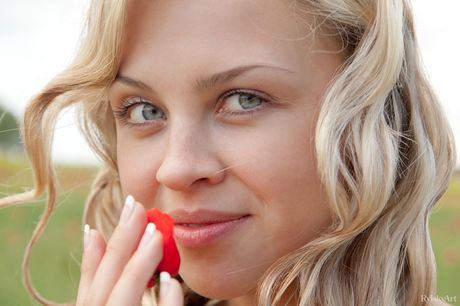 Thin teen Luciana poses nude in a field of yellow flowers