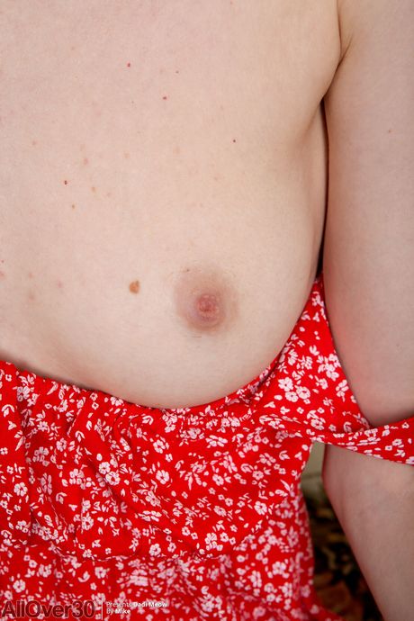 Slim MILF Dadi Meow undresses and shows her shaved pussy up close