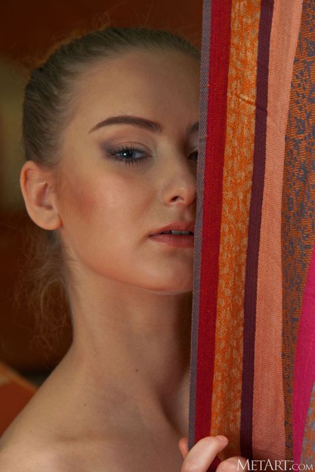 Skinny blonde Shyn removes her shawl to model naked with self-assuredness