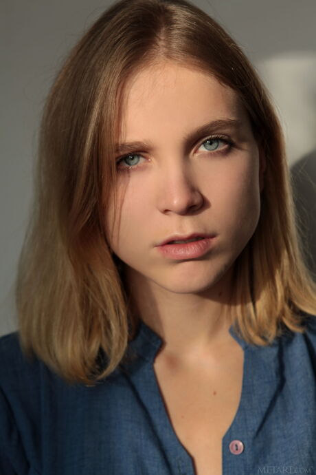 Ukrainian babe Nora Pace strips naked and demonstrates her big tits and twat