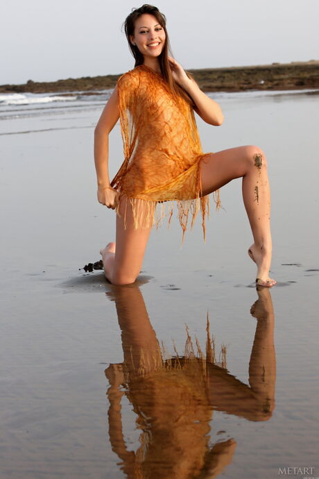 Met Art: Slender teen Lorena B poses nude on the beach showing her tiny tits & ass