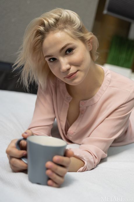 Lovely teen Lilly Mai removes her bikini to pose nude in her bedroom