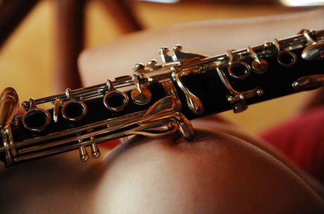 Brunette chick Matilde doffs a bikini before fingering her trimmed pussy