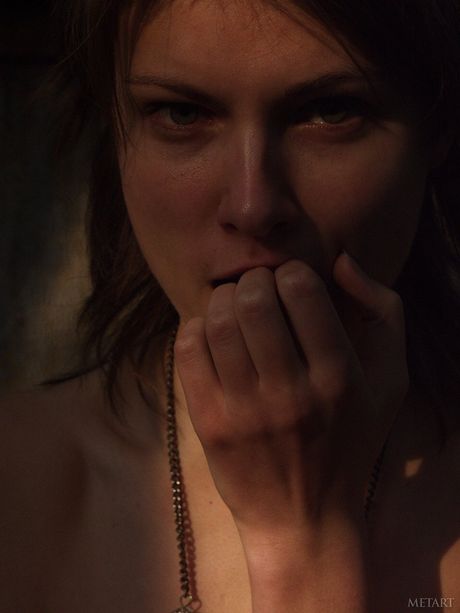 Bashful teen Models No Name poses naked in a field of wildflowers