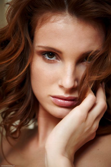 Redheaded teen Shani removes her bikini and heels to get naked on her bed