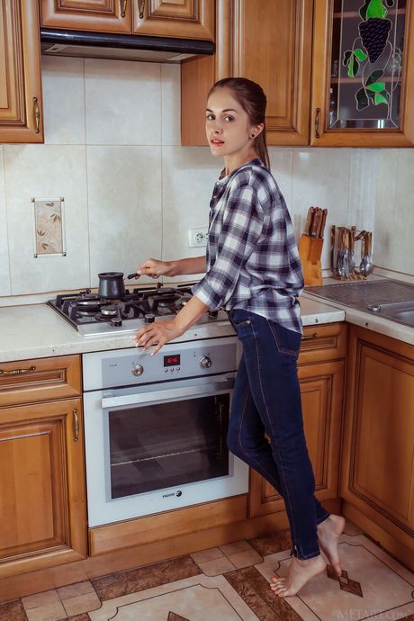 Slender teen Maria Espen strips naked and presents her big tits and twat