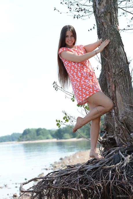 Cute teen Alisa L gets naked on a bench in a public park during solo action