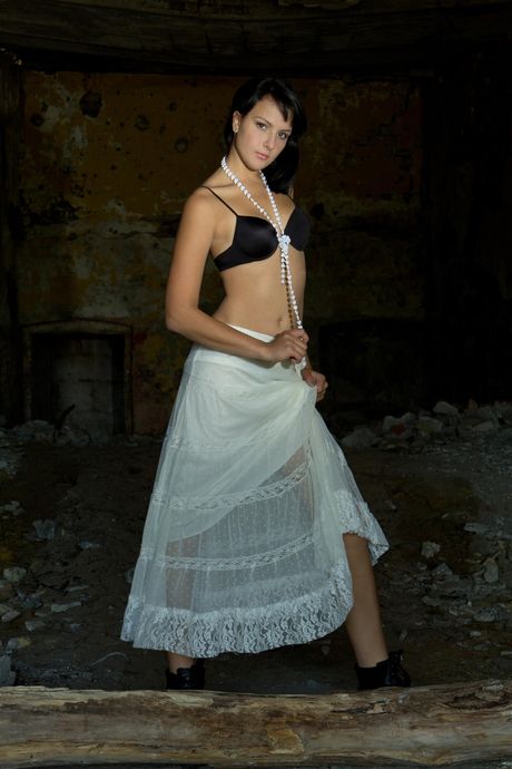 Emilie B strips off her black lingerie and exposes her hairy pussyShe